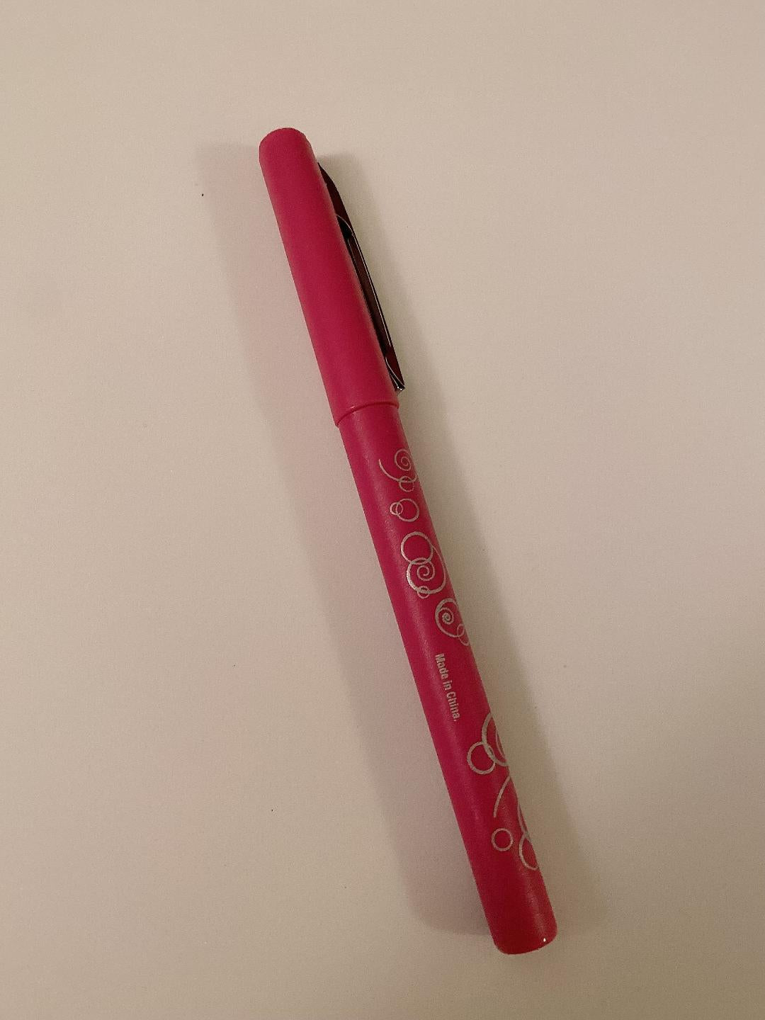 pinkish red pen