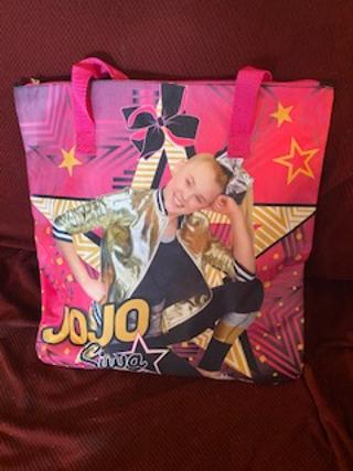 JOJO SIWA BIG BAG with itmes in it